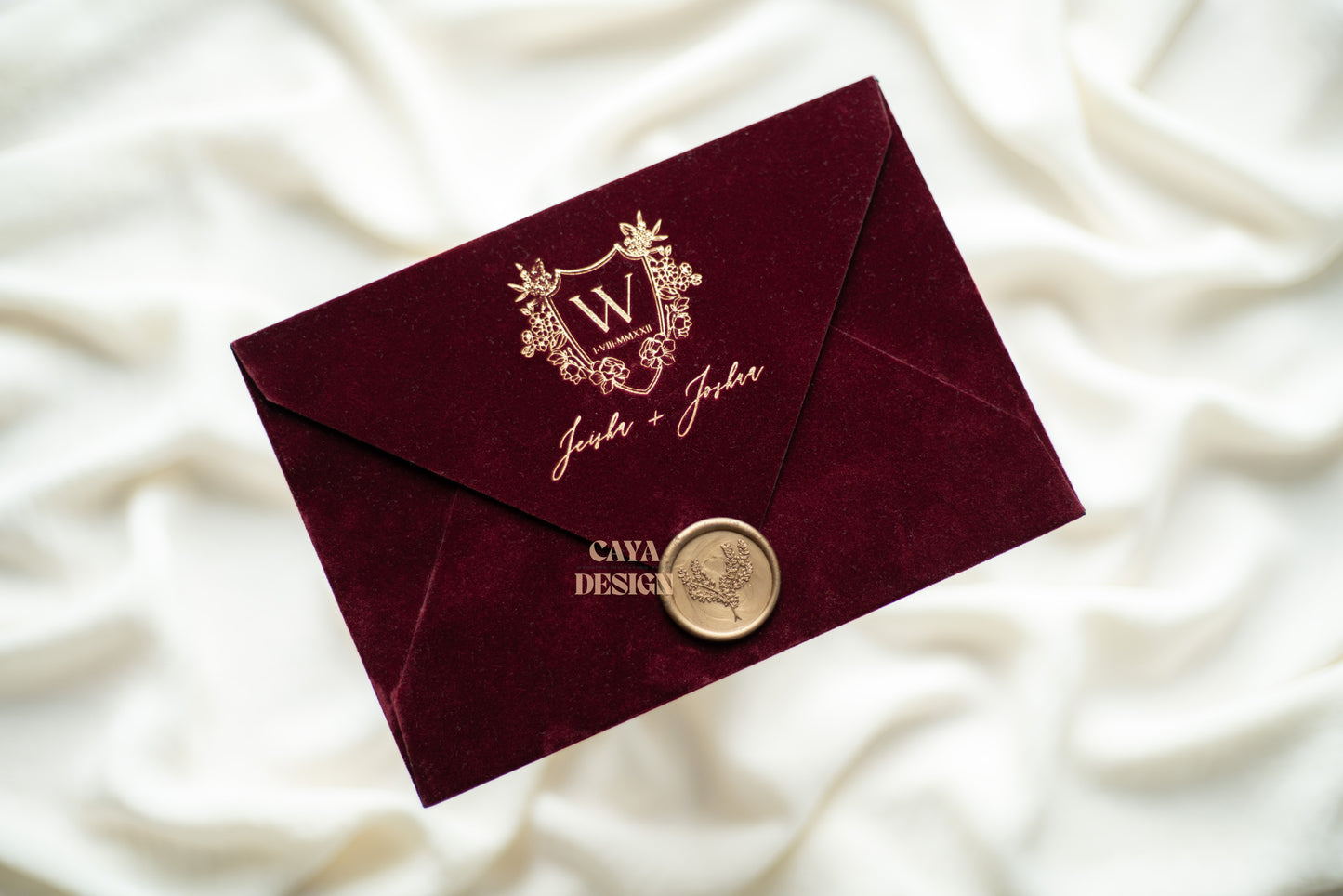 Burgundy Velvet Horizontal Wedding Invitation Front View with wax seal and gold foil