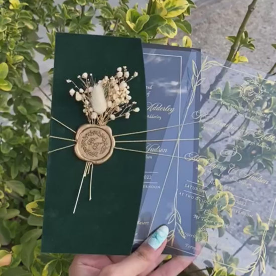 Video of a Emerald Green Velvet Half Fold Wedding Invitation with Acrylic Insert Card, Gold Foil details, wax seal and flowers