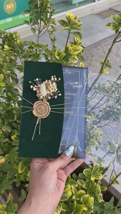 Video of a Emerald Green Velvet Half Fold Wedding Invitation with Acrylic Insert Card, Gold Foil details, wax seal and flowers