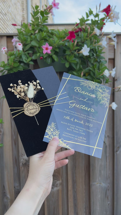 Video of a Black Velvet Half Fold Wedding Invitation with Acrylic Insert Card, Gold Foil details, wax seal and flowers