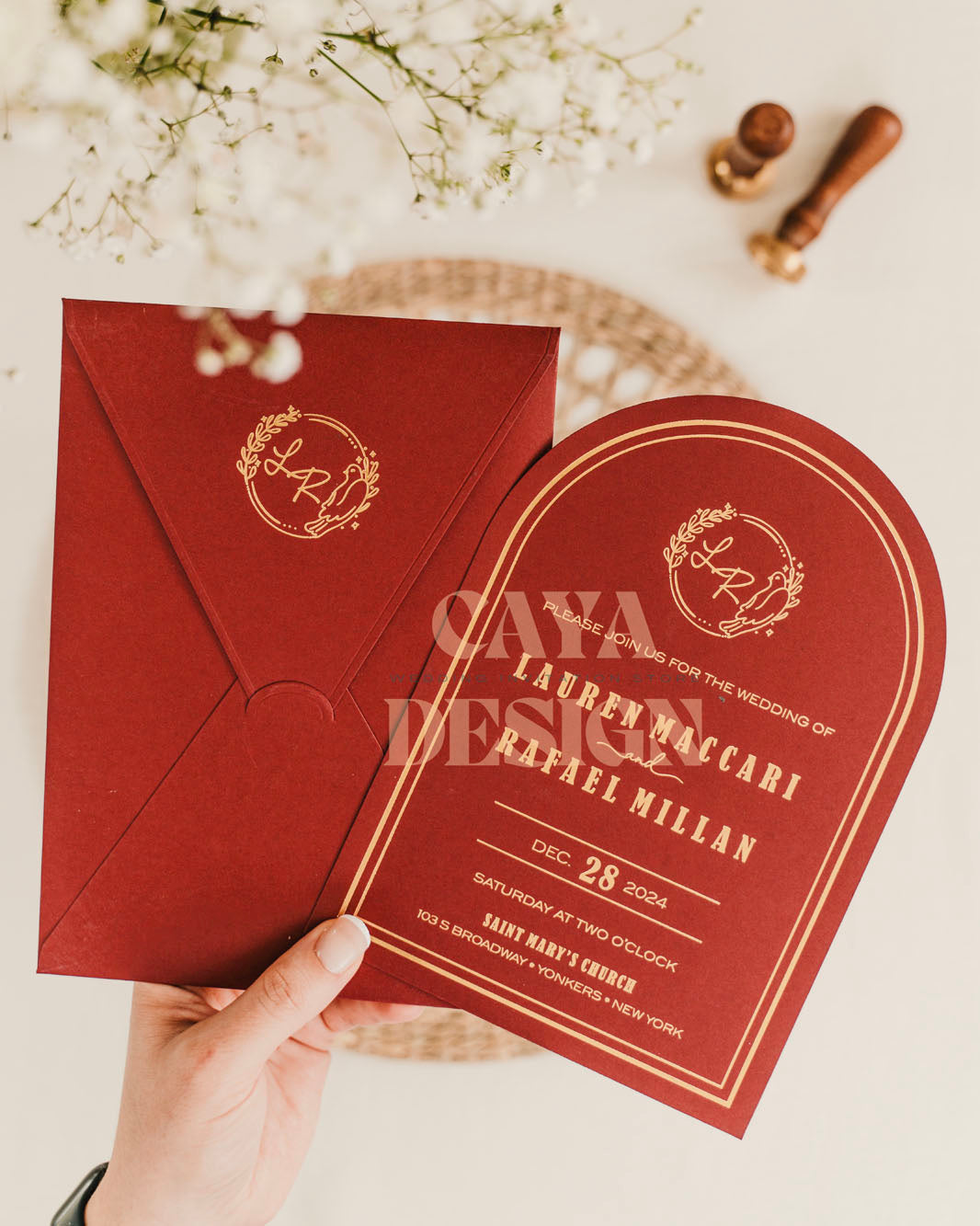 Red Paper Vertical Wedding Invitation with Paper Insert Card and Gold Foil close up Front View in hands