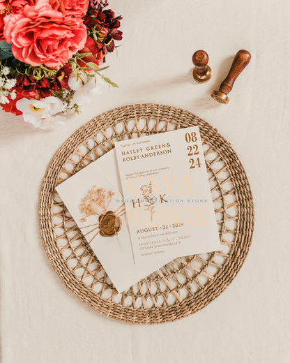 White Paper Half Fold Wedding Invitation with Paper Insert Card and Gold Foil, wax seal and dried flowers Front View at a wedding